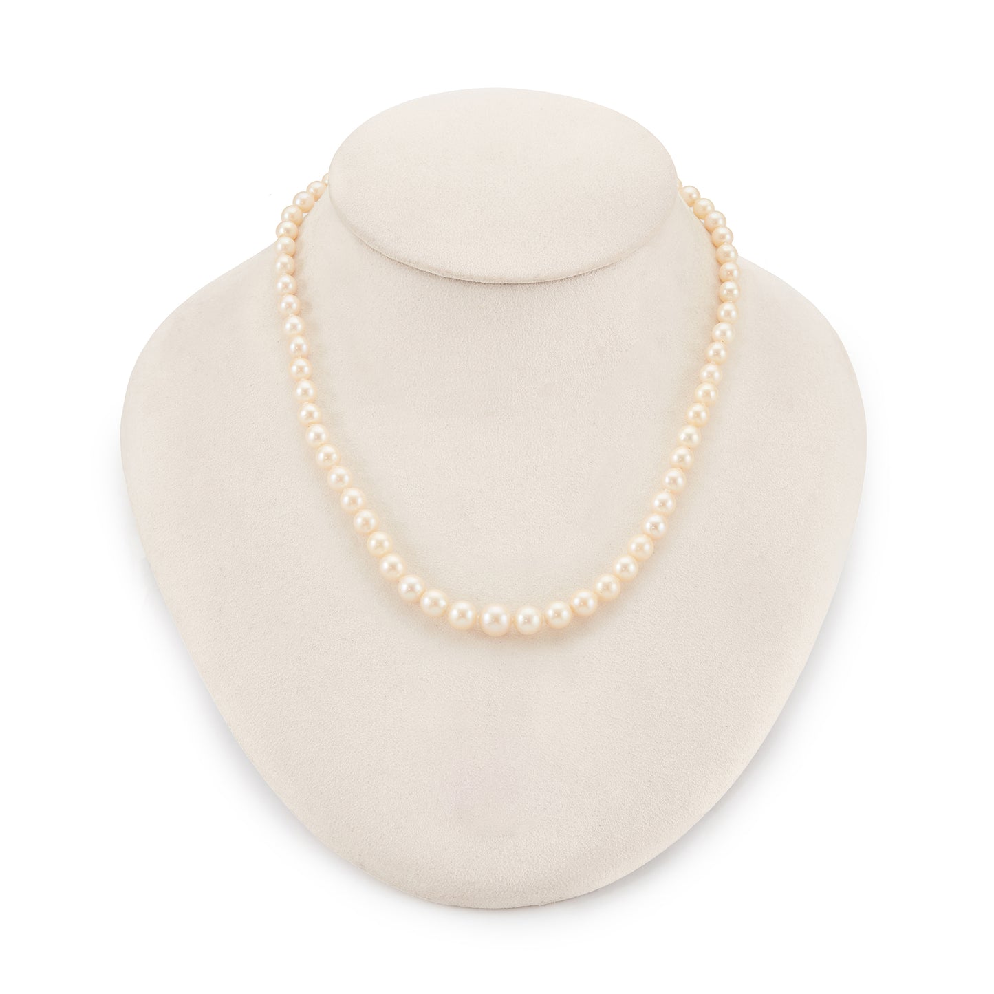 Classic vintage string of graduated seawater pearls with a sterling silver and pearl clasp. The pearls have a creamy hue and a good lustre.