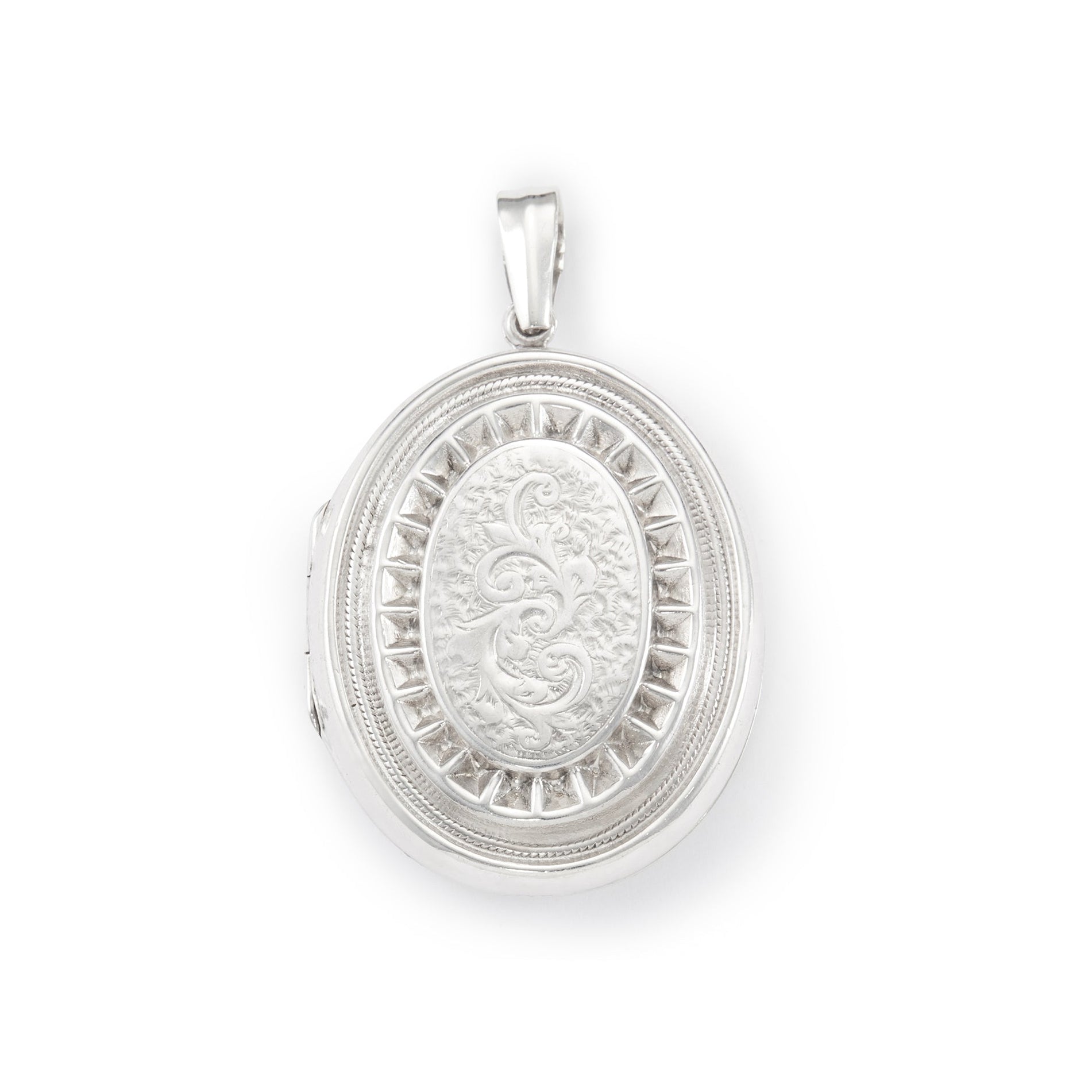 Lovely vintage sterling silver locket with ornate engraving detail on the front.