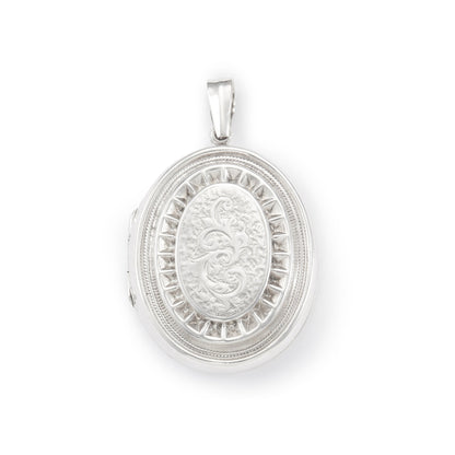 Lovely vintage sterling silver locket with ornate engraving detail on the front.