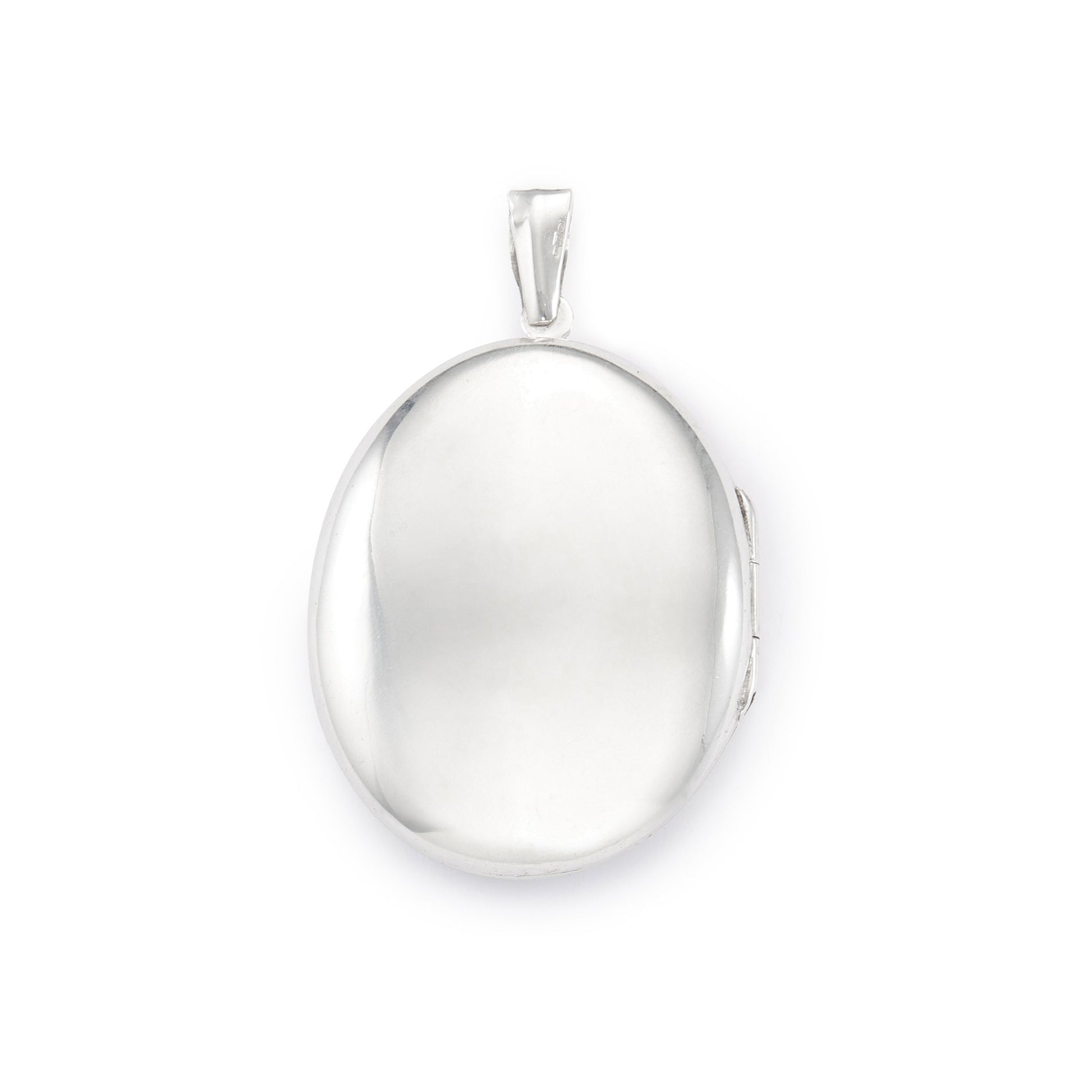 Lovely vintage sterling silver locket with ornate engraving detail on the front.