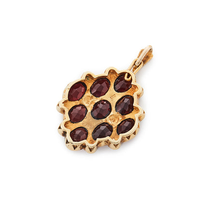 Gorgeous vintage 14ct yellow gold pendant set with nine beautifully faceted garnets and twelve seed pearls.
