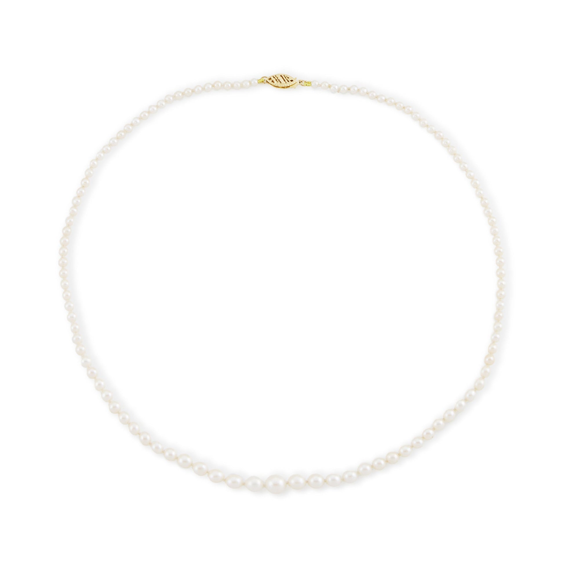 Lustrous graduated string of vintage cultured seawater pearls with a 14ct gold filigree clasp.