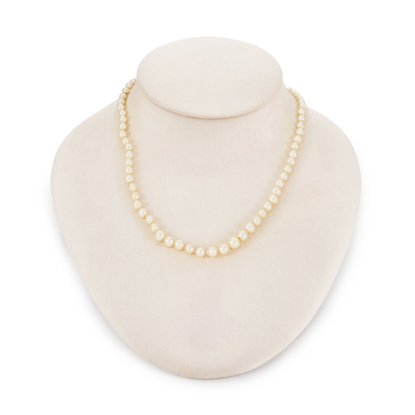 Lustrous graduated string of vintage cultured seawater pearls with a 14ct gold filigree clasp.