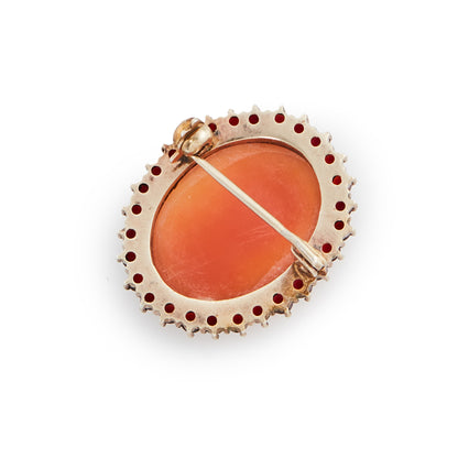 Pretty silver gilt cameo surrounded by twenty-eight deep red faceted Bohemian garnets.