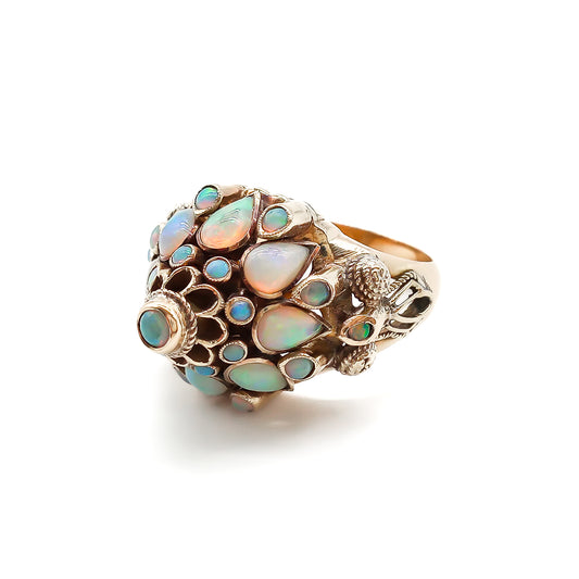 Spectacular 18ct rose gold cocktail ring with lustrous opals in a multi-tier setting.