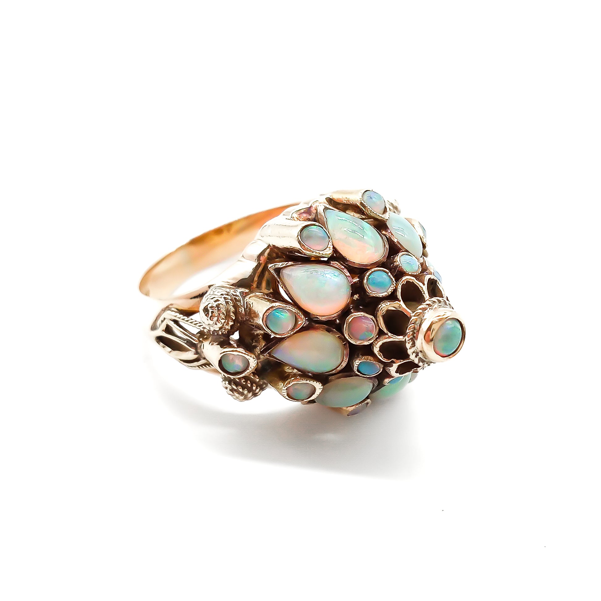 Spectacular 18ct rose gold cocktail ring with lustrous opals in a multi-tier setting.