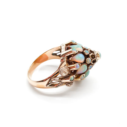 Spectacular 18ct rose gold cocktail ring with lustrous opals in a multi-tier setting.