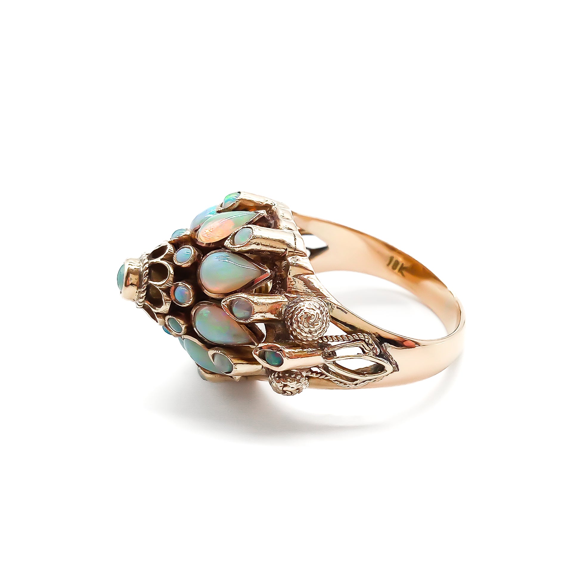 Spectacular 18ct rose gold cocktail ring with lustrous opals in a multi-tier setting.