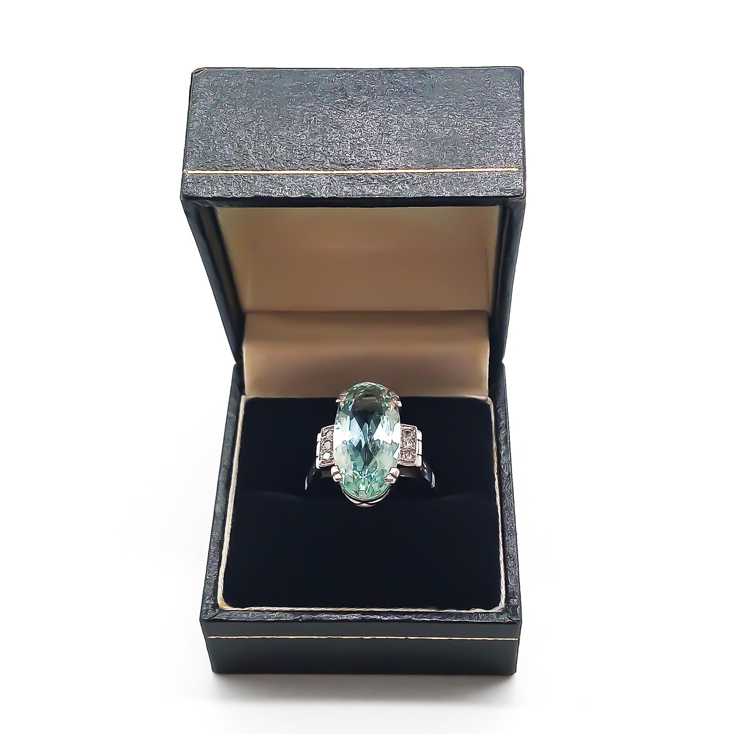 Magnificent 18ct white gold ring set with a beautifully faceted 7ct oval aquamarine and six small diamonds.