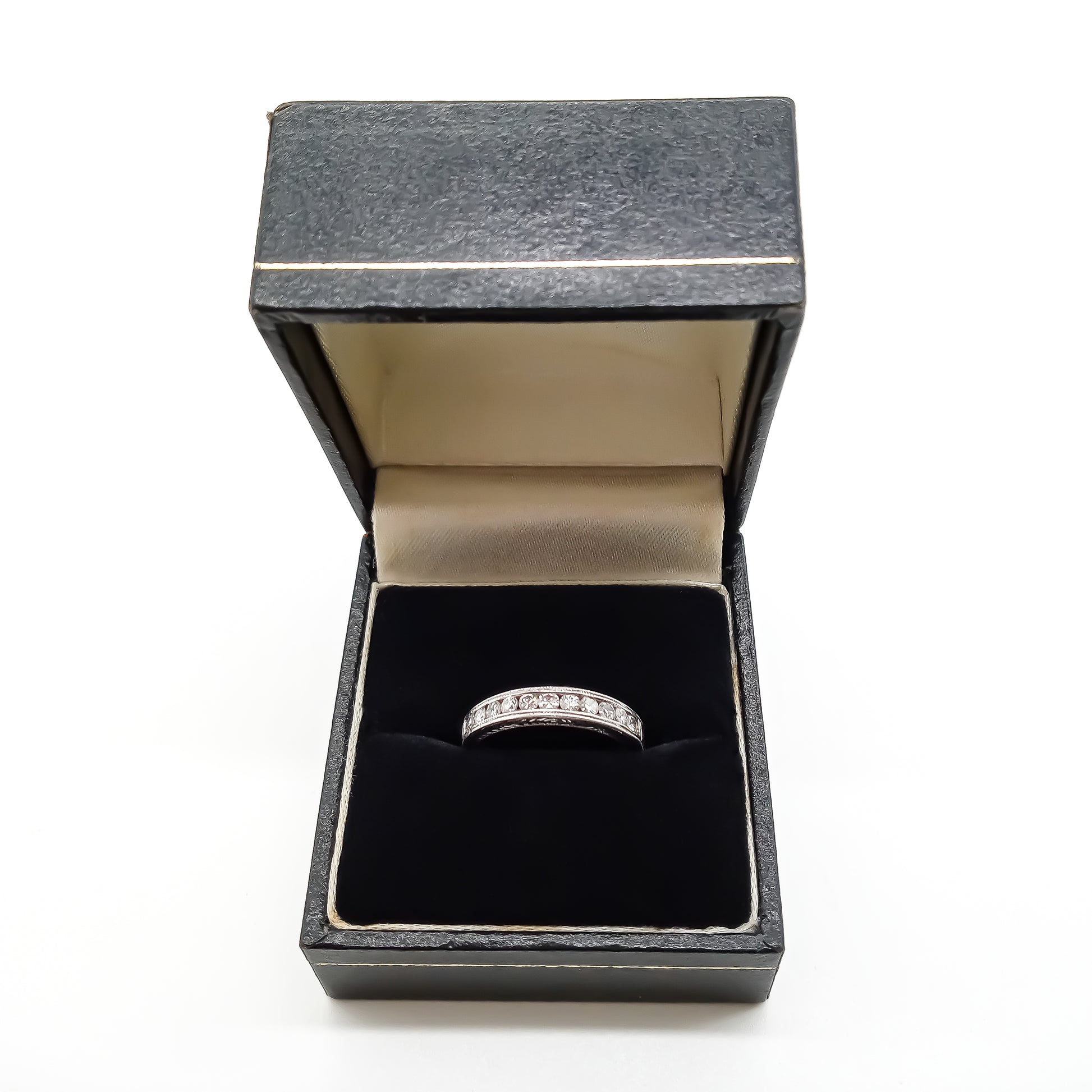 Classic 18ct white gold half eternity ring with eleven sparkling diamonds in a tube setting.