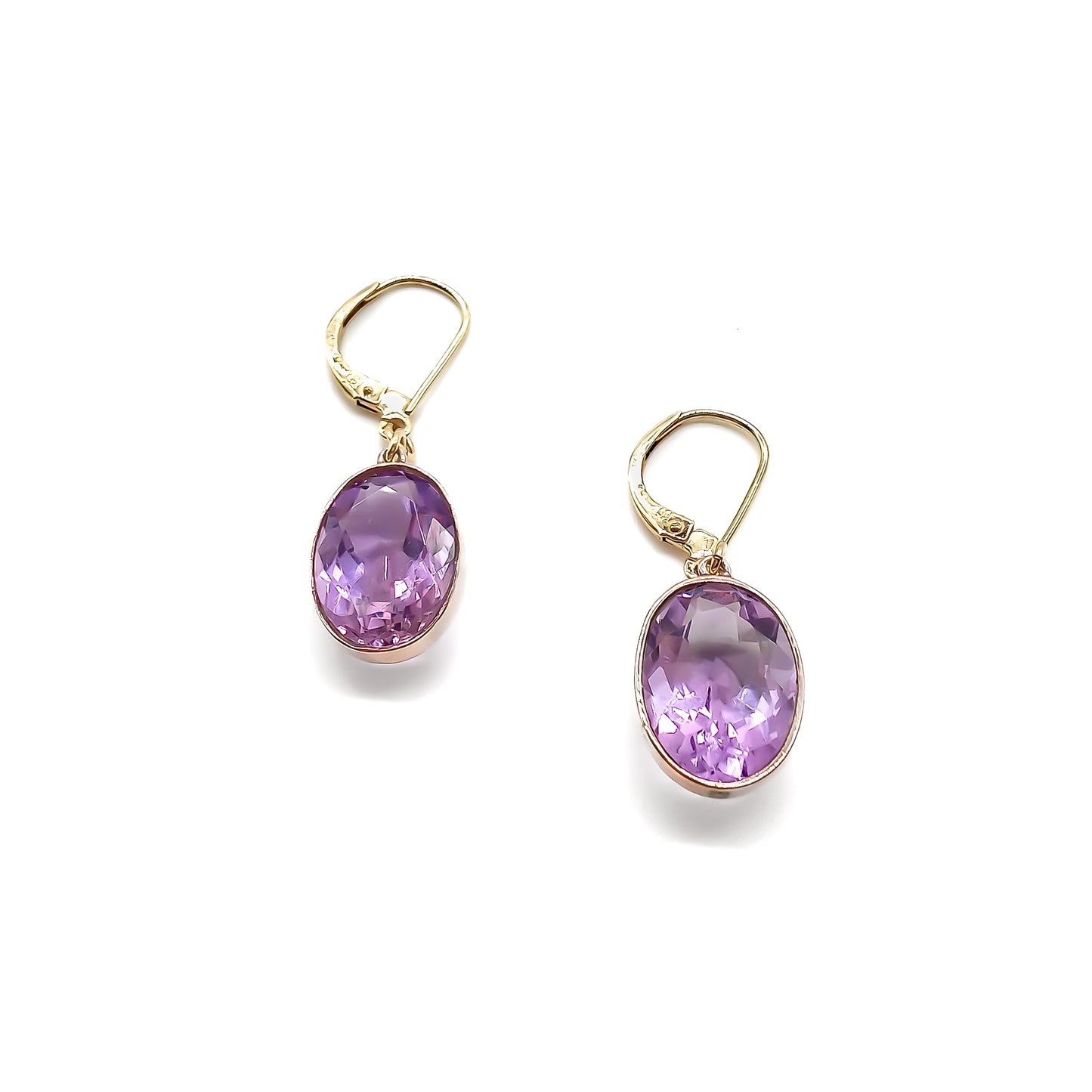 Classic 9ct gold drop earrings set with beautifully faceted oval amethysts.