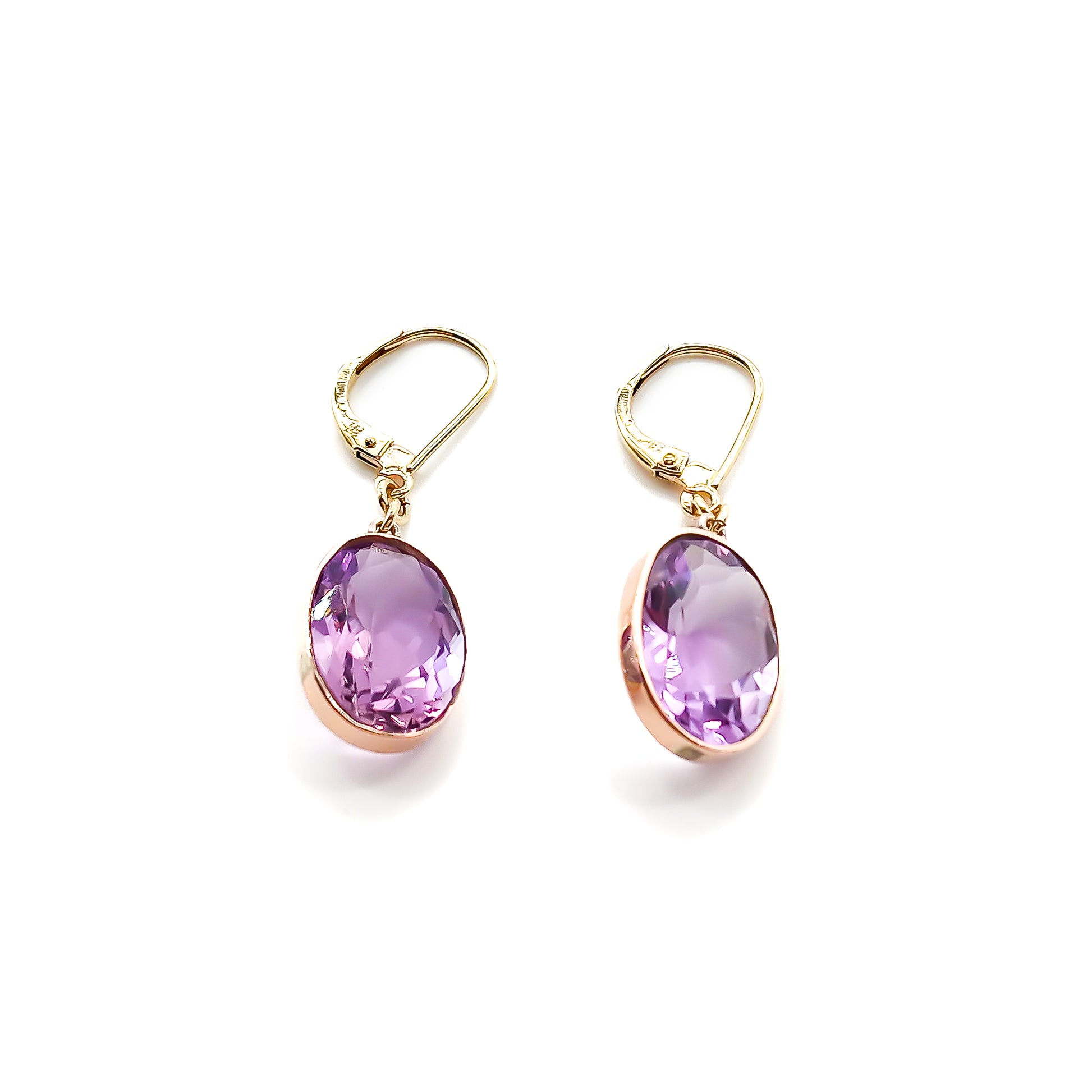 Classic 9ct gold drop earrings set with beautifully faceted oval amethysts.