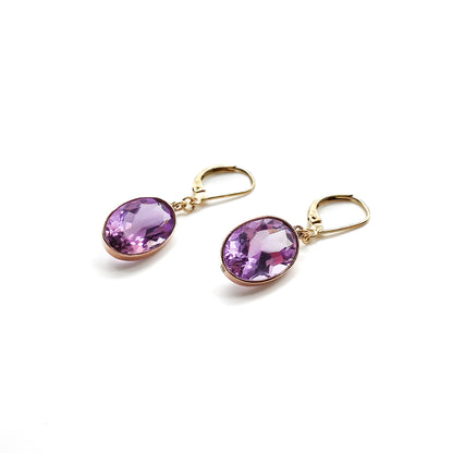 Classic 9ct gold drop earrings set with beautifully faceted oval amethysts.