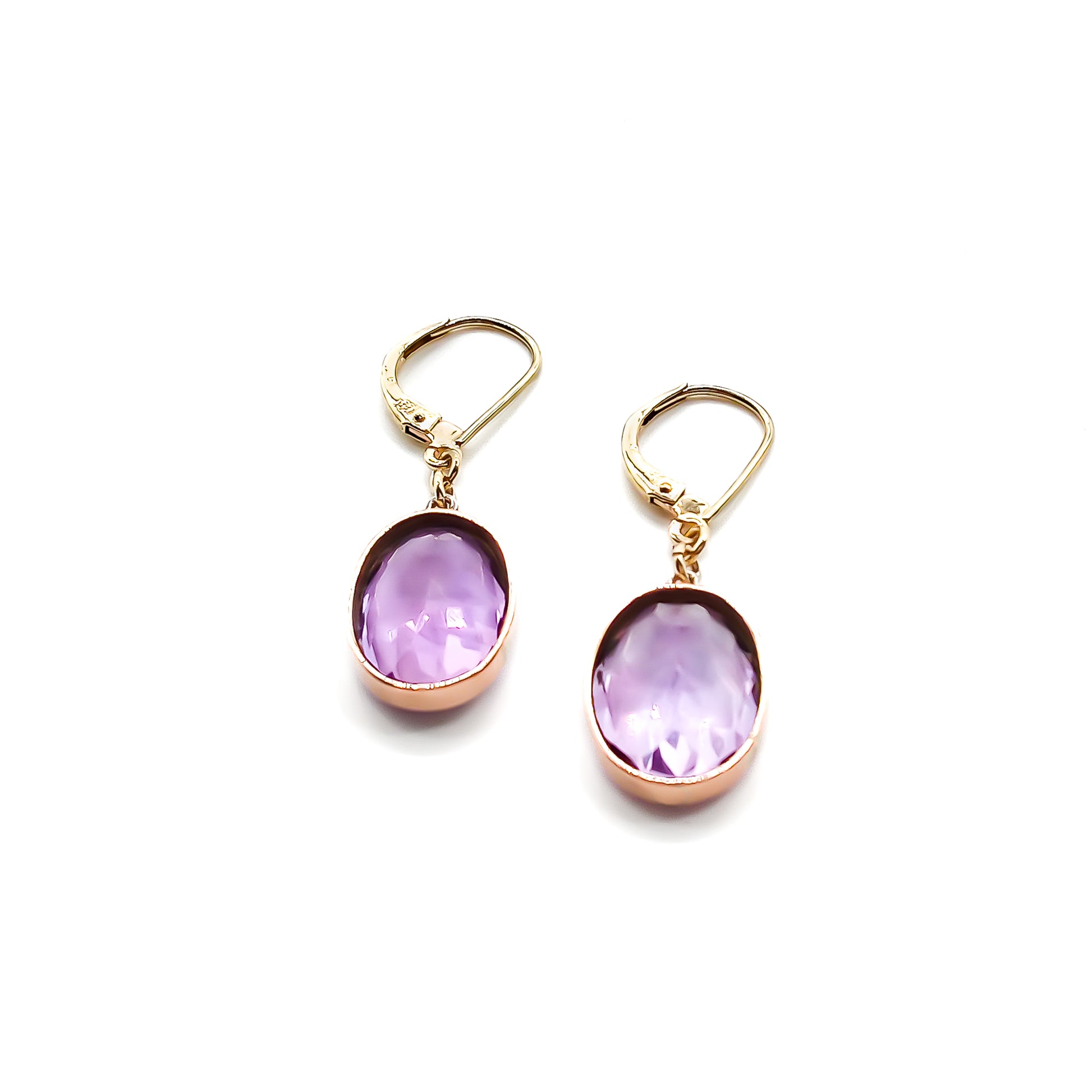 Classic 9ct gold drop earrings set with beautifully faceted oval amethysts.