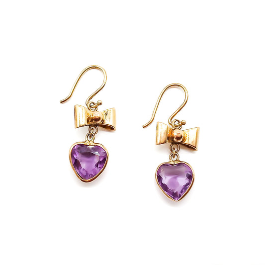 Lovely 9ct yellow gold bow earrings with dangling heart-shaped amethyst drops.