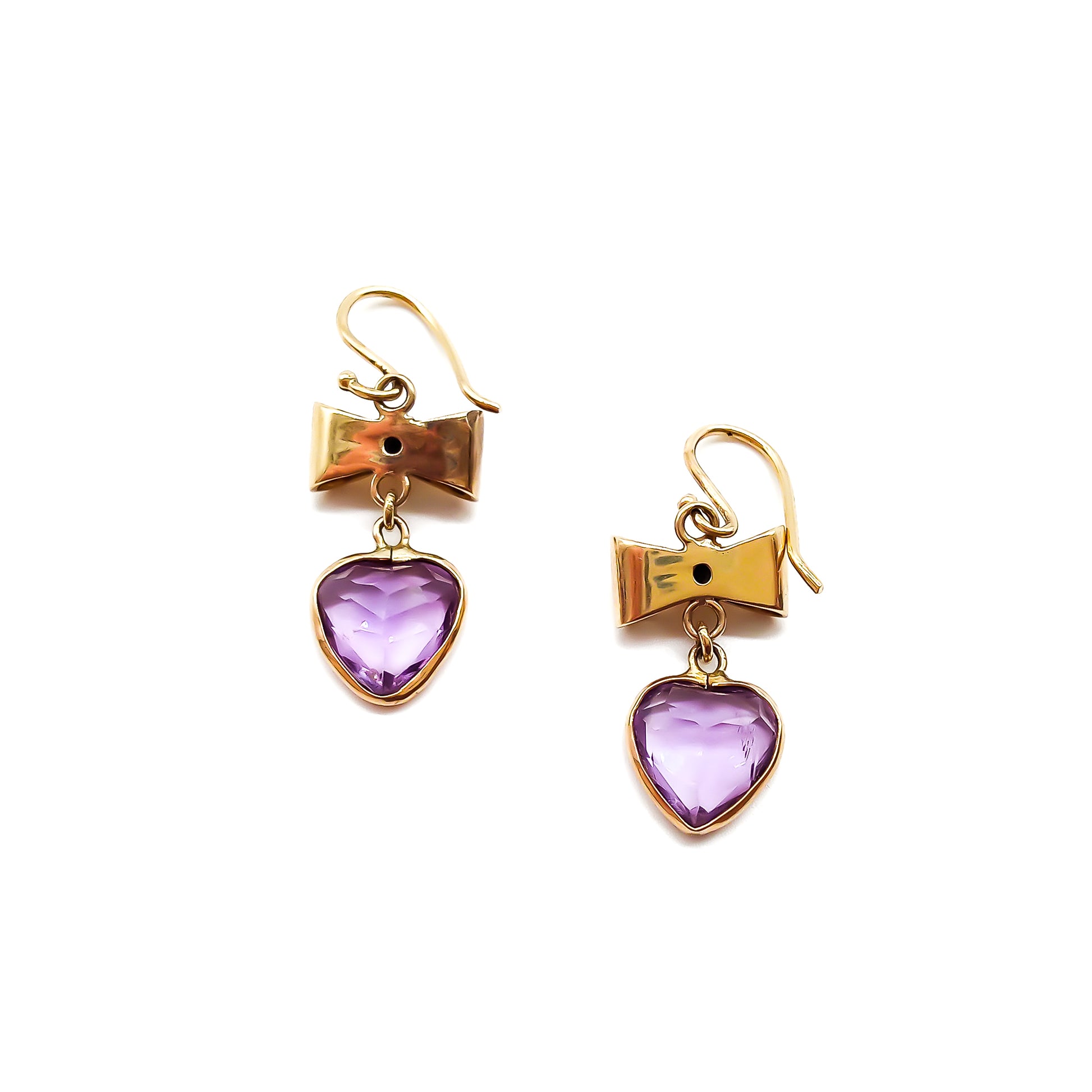 Back view of 9ct yellow gold bow earrings with dangling heart-shaped amethyst drops.